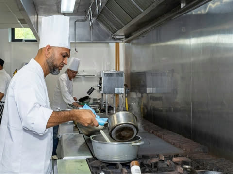 A Spice Merchants chef working with saucepans during the ARTA national cook-off.